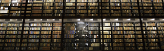 towering shelves of books in Beinecke Library