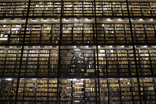 towering shelves of books in Beinecke Library